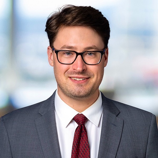 James W. Hill, Partner at Greenberg Glusker LLP seen in white color shirt and grey color suit